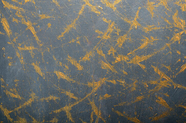 black and gold background with strokes and scratches