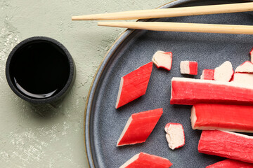 Plate with tasty crab sticks and sauce on light background, closeup © Pixel-Shot