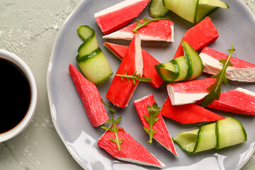 Plate with tasty crab sticks on light background, closeup © Pixel-Shot