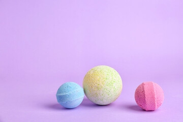 Bath bombs on lilac background