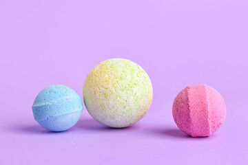 Bath bombs on lilac background