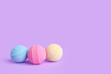 Bath bombs on lilac background