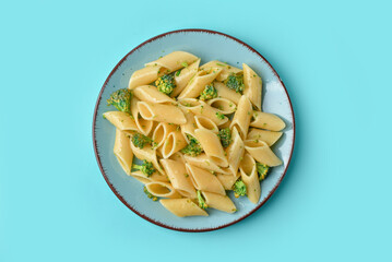 Pasta with broccoli on turquoise background
