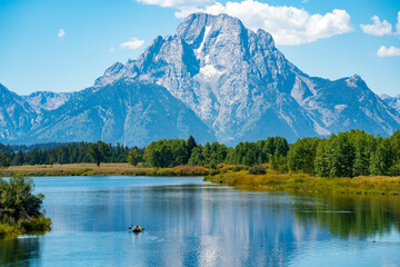 Mt Moran over Snake River with canoe, Grand Teton National Park, Wyoming, United States.