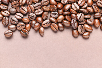 Coffee beans on beige background