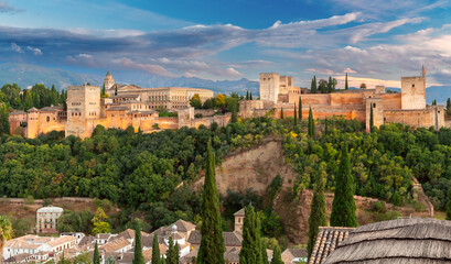 Fototapeta na wymiar Granada. Fortress wall with towers in the ancient palace complex of the Alhambra.
