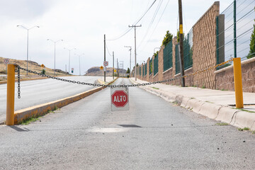Restricted entry with chain and stop sign to private area