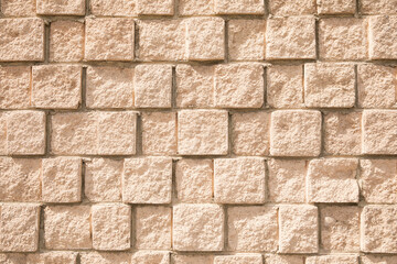 Beige textured brick wall. Perfect for background use
