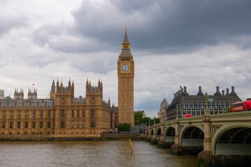 Fototapeta na wymiar Big Ben, Palace of Westminster and Westminster Bridge in a cloudy day in London, England, UK. Big Ben and Palace is World Heritage Site since 1970. 