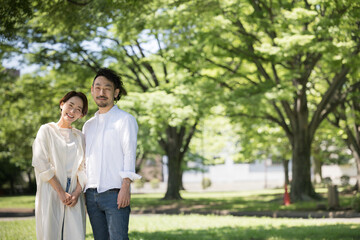 Image of happy couple or married couple Bearded man and beautiful woman Wide angle Looking at camera