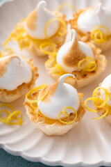Fototapeta na wymiar Lemon meringue tarts, one bite desserts idea
