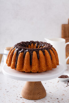 Orange pound cake with dark chocolate ganache and sprinkles