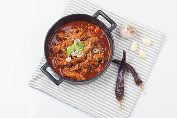 Chicken feet seasoned with vegetables.