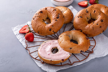 Variety of bagels served with strawberry cream chees and fresh berries - Powered by Adobe