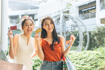 Asian beautiful two women shopping goods outdoor in department store. 