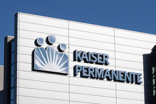 Irvine, CA, USA - May 7, 2022: Closeup of the Kaiser Permanent logo seen at its Irvine Medical Center in Orange County, California. Kaiser Permanente is an American integrated managed care consortium.