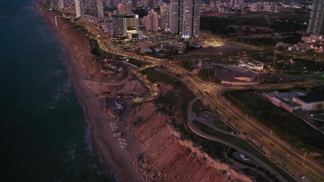 Aerial view of the city of Netanya and its coastline - part of the Israeli coastal plain, at night