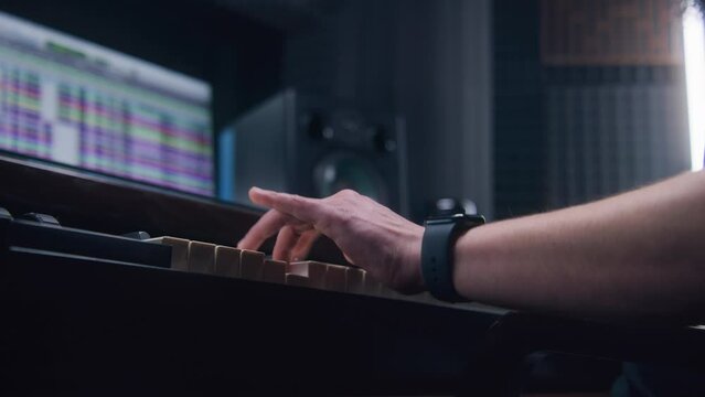 Audio engineer, producer uses MIDI controller, digital electric piano for creating music. Screen showing DAW software interface with sound tracks. Sound recording studio. Music Generative AI