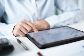 Business woman hand presses on screen digital tablet Online Digital marketing  technology