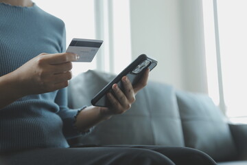 Close up of woman hand using credit card and laptop for payment and online shopping, Online shopping, payments digital banking, E-commerce concept.