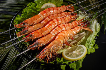 shrimp meat,BBQ food, indoor shot, dark tabletop background