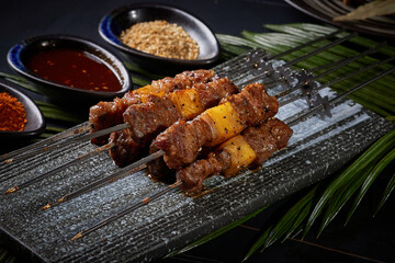 BBQ lamb and beef skewers,,BBQ food, indoor shot, dark tabletop background