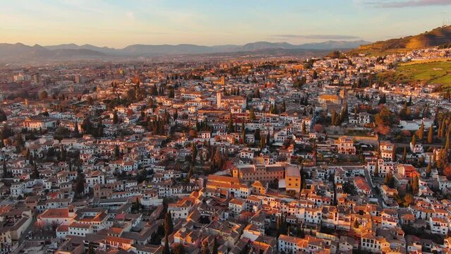 Aerial view of Granada city, Albaicin district at sunset, old Moorish quarter of the city, located on a hill facing the Alhambra. Andalusia, Spain