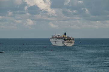 Fun cruiseship cruise ship liner Sensation sail away departure from Miami port during sunset...