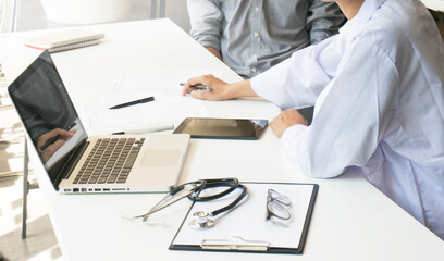 Doctor check body by stethoscope. Healthcare and medical concept. Professional medical doctor in white uniform gown coat interview consulting patient.