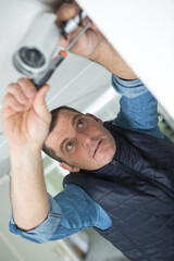 technician fixing video surveillance camera