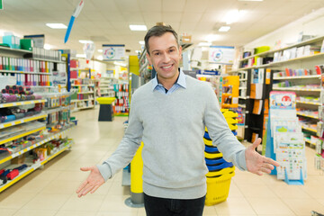 young seller in supermarket