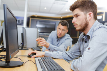 portrait of an engineer training apprentices