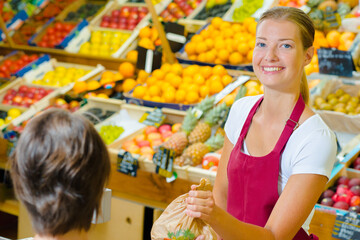 a lady is grocery serving a client