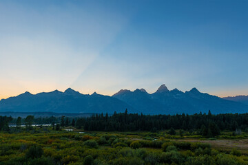 Obraz premium Grand Teton mountain peaks with sunset sunbeam, Grand Teton national park, Wyoming, USA.