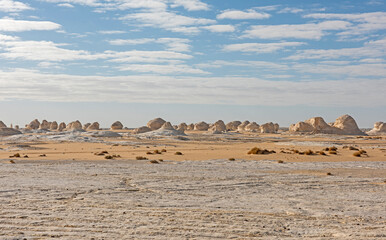 Barren desert landscape in hot climate with rock formations