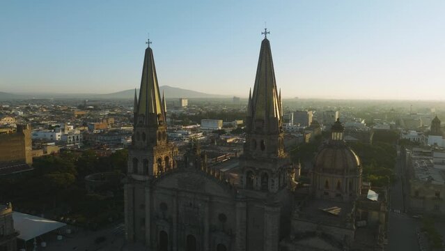 Aerial of historical building main landmark in Guadalajara in golden sunrise light. The Catedral Basilica de la Asuncion de Maria Santisima, the Guadalajara Cathedral touristic landmark Generative AI