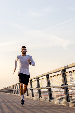 Athletic man stretch and exercise on the  brigde
