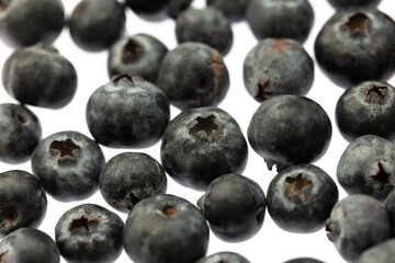 Ripe blueberries isolated on white background. Macro.