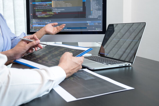 Team of programmers working with computer programming, professional development, and coding technology, working on high-quality visual software development websites