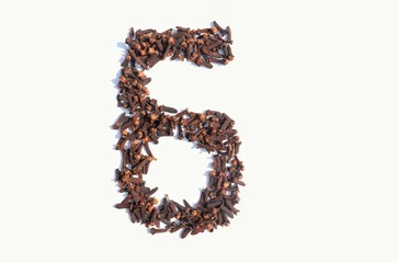 6 Six Number Written with Dry Cloves Isolated on White Background