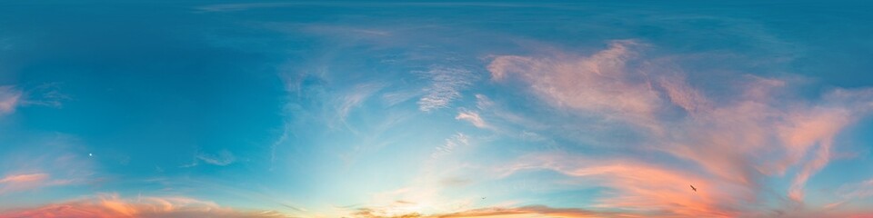 Sunset sky panorama with bright glowing pink Cirrus clouds. HDR 360 seamless spherical panorama....