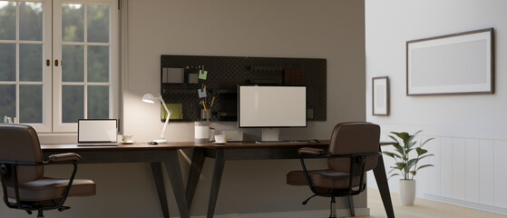 Modern home office with desktop computer with stationery on wooden table