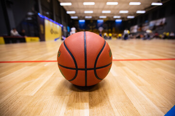 Closeup of basketball ball on the court during wheelchair