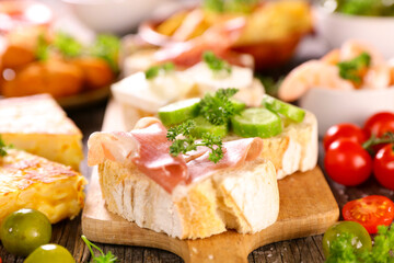 spanish tapas- toast with prosciutto ham and assortment food