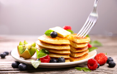 Stack of pancake,  berry fruit and butter