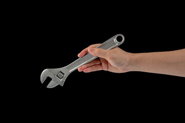 A wrench in hand isolated on black background.