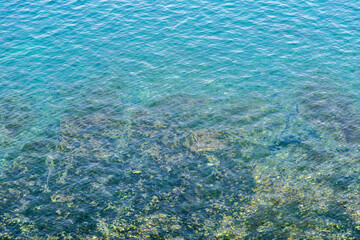 Naklejka na ściany i meble Blue sea surface with reflection. Natural background.
