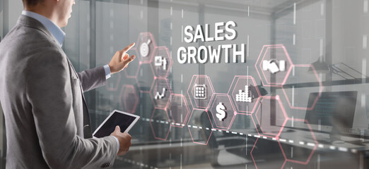 Sales Growth Man clicks inscription on virtual 3D screen