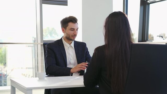 Businessman having job interview with businesswoman