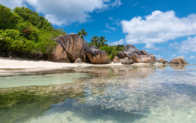 Amazing natural beach in Seychelles with granite rocks and crystal clear turquoise blue sea. Anse Source d' Argent La Digue Island.